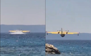 Pogledajte kako kanader prelijeće preko plaže u Makarskoj tokom akcije gašenja požara